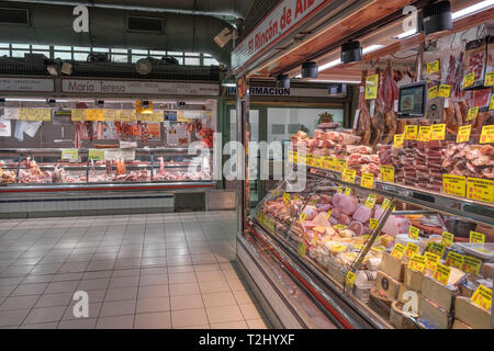 butcher shops on ground level in the mercado central, the central market hall in the city of Alicante, Spain Stock Photo