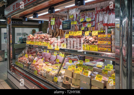 butcher shops on ground level in the mercado central, the central market hall in the city of Alicante, Spain Stock Photo