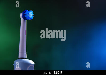 Modern electric toothbrush powered by rechargeable battery. Stock Photo