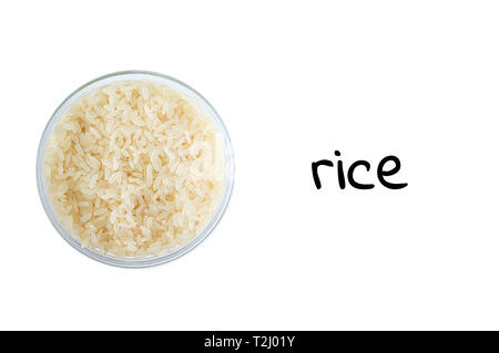 Rice grits in a glass bowl. View from above. White isolate Stock Photo