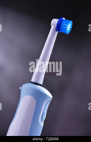 Modern electric toothbrush powered by rechargeable battery. Stock Photo