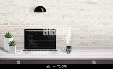 Development studio concept. Laptop with script code. Free space for text beside. Stock Photo