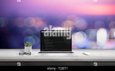 App development on laptop computer with code editor on display. Stock Photo