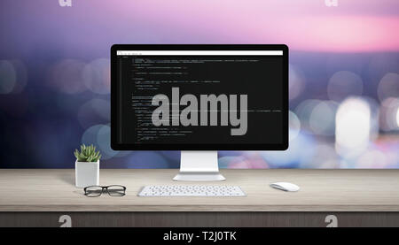Concept of programming on a computer. Work desk with computer display and text editor. Stock Photo