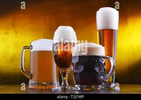 Composition with four glasses of beer. Stock Photo