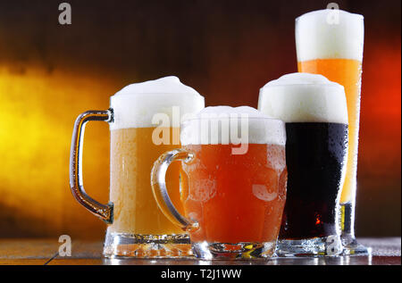 Composition with four glasses of beer. Stock Photo