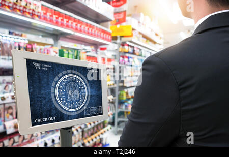 Machine learning systems technology , accurate facial recognition biometric technology and artificial intelligence concept.Customer check out with fac Stock Photo