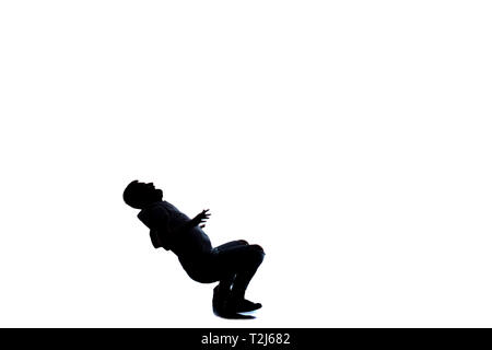 Modern man doing break dance routine Stock Photo