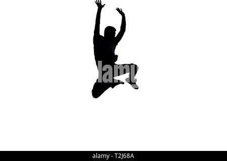An urban guy is doing breakdance in the studio Stock Photo