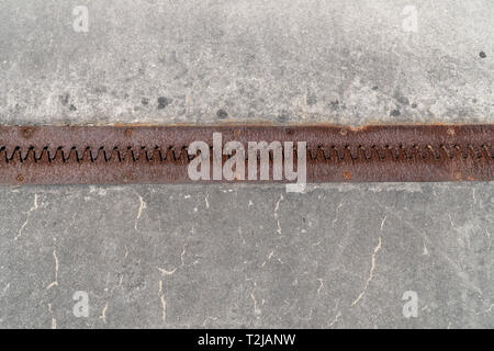 Concrete background texture with rusty piece of metal. Light Gray background texture with cracks . Architecture Stock Photo