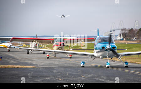 Private aircrafts line up on runway awaiting for take off, Tangier, Virginia Stock Photo