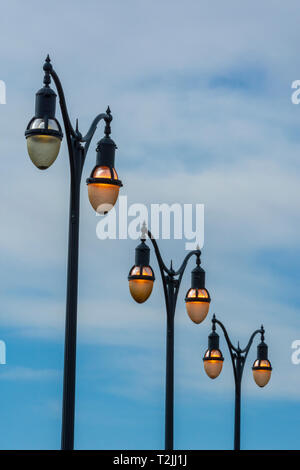 A row of parking lot lights in the early morning, Castle Rock Colorado US. Photo was taken in April. Stock Photo