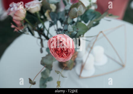 Beautiful flowers in rustic style at a wedding party. Stock Photo