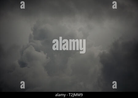 gray cotton ball storm clouds background Stock Photo