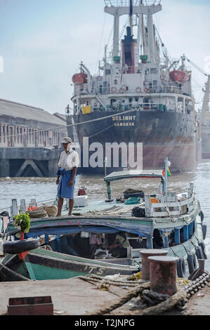 Ships and boats at the shipping port on the Yangon River, Yangon Myanmar (Burma) Stock Photo