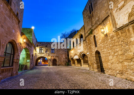 Ancient street in old town Rhodes Greece at twilight. Stock Photo