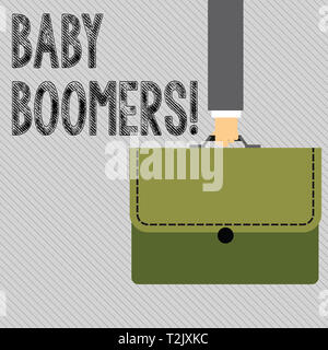 Text sign showing Baby Boomers. Business photo showcasing demonstrating who is born in years following Second World War Businessman Hand Carrying Colo Stock Photo