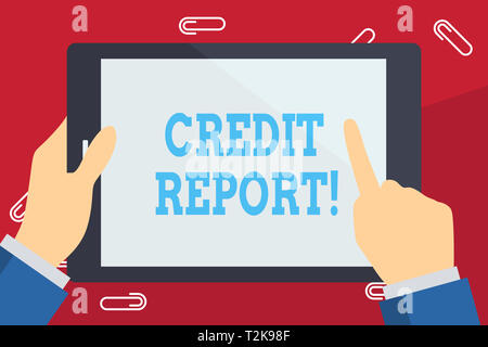Writing note showing Credit Report. Business concept for detailed report individuals history prepared by credit bureau Businessman Hand Holding and Po Stock Photo