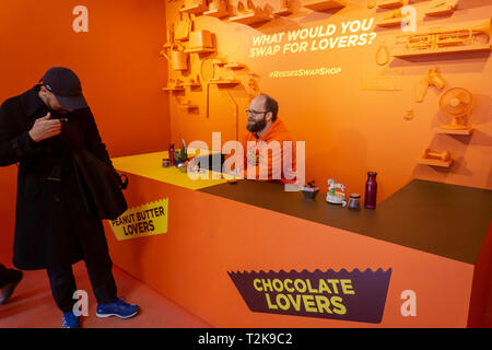 Candy lovers exchange unwanted but 'loved' items for samples of Reese's 'Chocolate Lovers' and 'Peanut Lovers' limited edition cups at the Reese's Swap Shop pop-up in New York on Wednesday, March 27, 2019. As can be judged by the name the new limited edition peanut butter cusp contain either more chocolate and more peanut butter depending on your particular preference. (© Richard B. Levine) Stock Photo