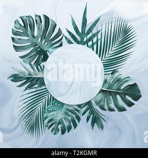 Group of tropical leaves on marble background.Copy space.Nature and summer concept ideas Stock Photo