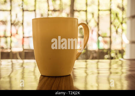 Closeup image of a cup of Cappuccino, mocha, latte, Americana, espresso hot coffee aroma for on rustic wooden table background in cafe with backdrop o Stock Photo