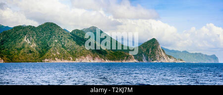 Panoramic view of Dominica coastline from ferry to Martinique. Stock Photo