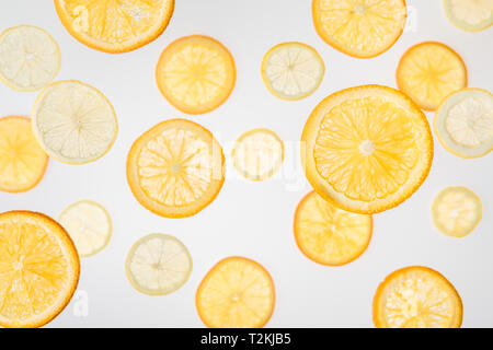 bright orange and lemon slices on grey background Stock Photo
