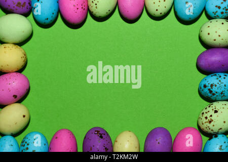 Colorful Candy Egg Frame With Green Copy Space Stock Photo