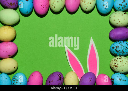 Colorful Candy Egg Frame With Pink Rabbit Ears Stock Photo