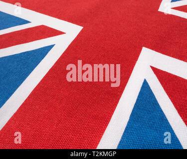 Wide angle macro shot Union Jack printed cotton material, showing colourful threads, warp & weft pattern, regular rows of stitches,Union Jack abstract Stock Photo