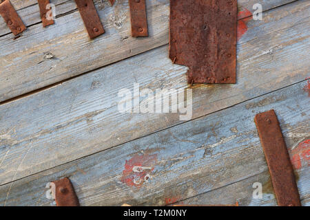 Blue wooden boards and rusty metal stripes as a real vintage background Stock Photo