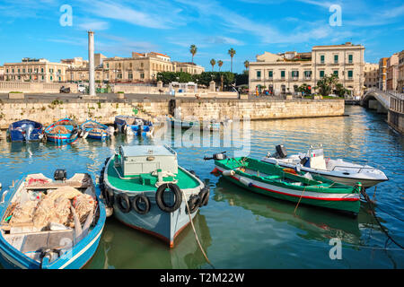 Fishing boats moored in harbor of Ortigia island. Syracuse, Sicily, Italy, Europe