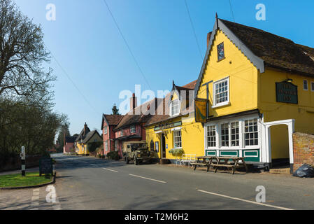 Chelsworth Suffolk, view of The Peacock Inn pub and colourful houses sited along The Street in the centre of the village of Chelsworth, Suffolk, UK Stock Photo