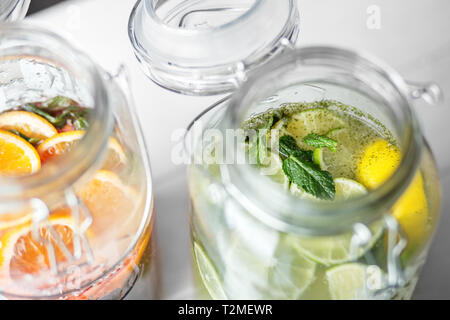 Refreshing lemonade with lime, juice and lemon in glass jars. Concept of drinks, summer, bar, rest, healthy food. Stock Photo