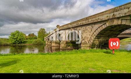 A lifebuoy at Atcham Old Bridge over the River Severn in Atcham, near Shrewsbury, Shropshire, England, UK Stock Photo