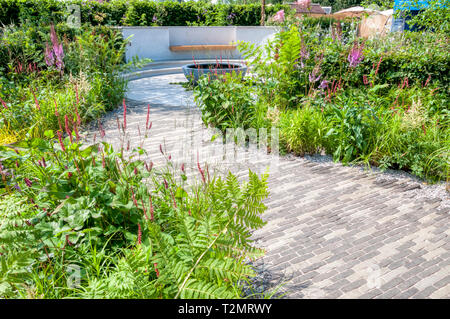 The South West Water Green Garden by Tom Simpson Garden Design at the RHS Hampton Court Palace Flower Show 2018 Stock Photo