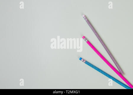 Pencil and erasers isolated on pastel background.writing goods Stock Photo