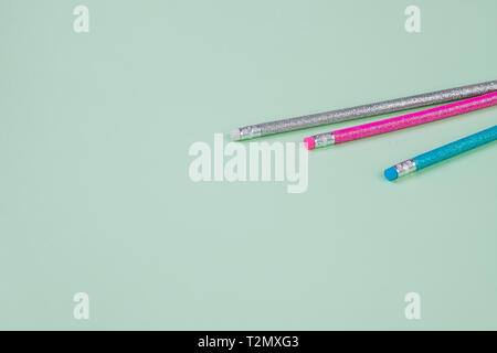 Pencil and erasers isolated on pastel background.writing goods Stock Photo