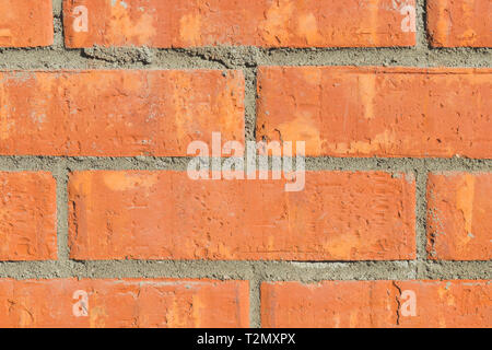 Colorful red and brown brick wall background in a Flemish stretcher bond pattern Stock Photo