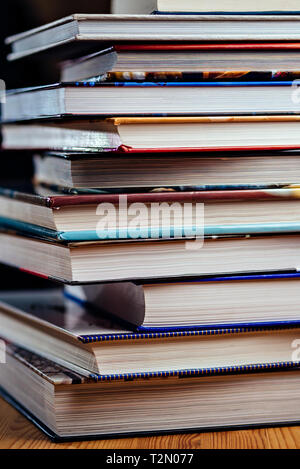 Many books piled on a stack Stock Photo