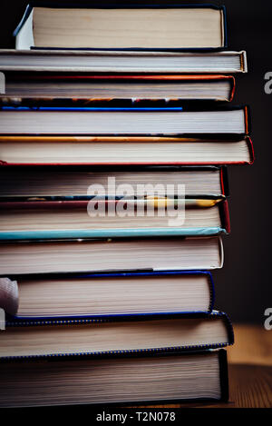 Many books piled on a stack Stock Photo