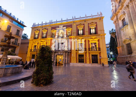 Bishops Palace, Plaza del Obispo, Malaga old town, Spain, lit up at at twilight Stock Photo