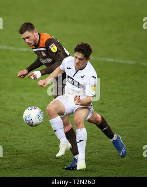 Swansea, UK. 02nd Apr, 2019. Henrik Dalsgaard of Brentford challenges Daniel James of Swansea city . EFL Skybet championship match, Swansea city v Brentford at the Liberty Stadium in Swansea, South Wales on Tuesday 2nd April 2019. this image may only be used for Editorial purposes. Editorial use only, license required for commercial use. No use in betting, games or a single club/league/player publications. pic by Andrew Orchard/Andrew Orchard sports photography/Alamy Live news Credit: Andrew Orchard sports photography/Alamy Live News Stock Photo