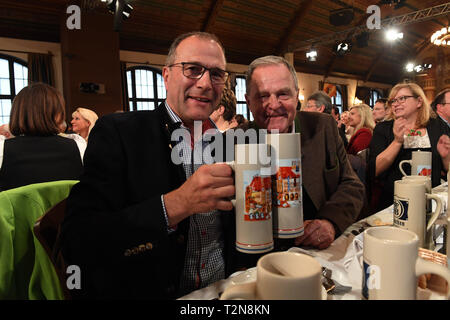 03 April 2019, Bavaria, München: Politicians Alexander Hold (FDP) (l) and Wolfgang Heubisch celebrate Maibock's visit to the Hofbräuhaus. Photo: Felix Hörhager/dpa Stock Photo