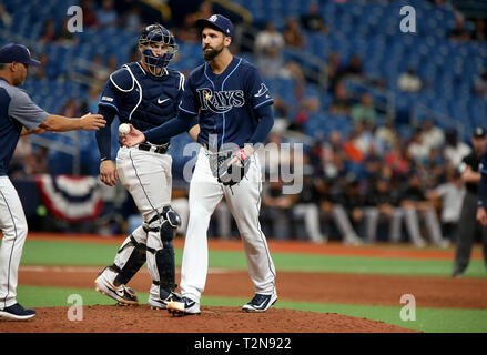 St. Petersburg, Florida, USA. 3rd Apr, 2019. DOUGLAS R. CLIFFORD | Times .Tampa Bay Rays relief pitcher Chaz Roe (52) relinquishes the ball after giving up a home run to Colorado Rockies catcher Chris Iannetta (22) during the 11th inning of Wednesdays (1/3/19) game between the Tampa Bay Rays and the Colorado Rockies at Tropicana Field in St. Petersburg. Credit: Douglas R. Clifford/Tampa Bay Times/ZUMA Wire/Alamy Live News Stock Photo