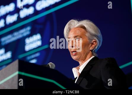Beijing, USA. 2nd Apr, 2019. Managing Director of the International Monetary Fund Christine Lagarde speaks during the 13th Annual Capital Markets Summit at the U.S. Chamber of Commerce headquarters in Washington, DC, the United States, April 2, 2019. Lagarde said here Tuesday that her institution anticipates a 'synchronized deceleration' of global economic growth in the years ahead. She also said that imposing import tariffs won't eliminate trade deficits and will cause 'potentially self-inflicted wounds.' Credit: Ting Shen/Xinhua/Alamy Live News Stock Photo