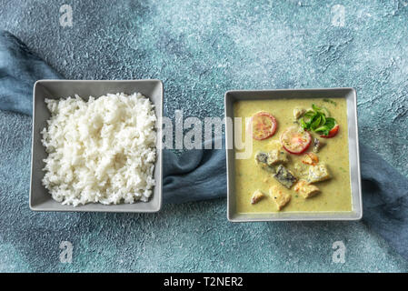 Thai red chicken curry with white rice Stock Photo