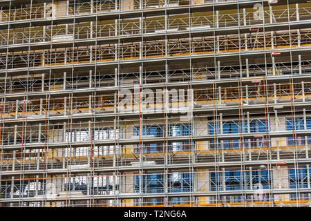 Construction scaffold to restore a building in Milan, Italy Stock Photo