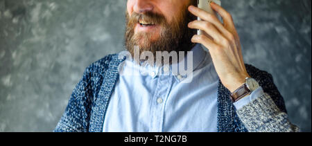 Happy Bearded Man Talk at Phone. Open and Friendly Communication with a Pleasant Interlocutor. Good News Concept Stock Photo