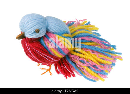 Funny handmade Easter Heaven paradise bird are made of colored threads and wires . Isolated on white studio macro shot Stock Photo
